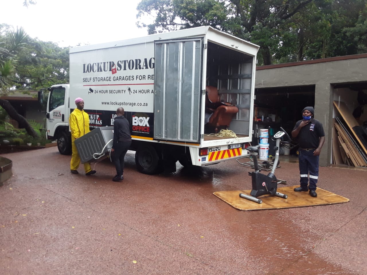 Lock Up Storage team carrying items to storage unit